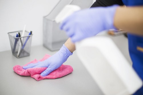 Cleaner preparing a short-let bedroom in Barnet for new guests