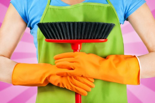 Local upholstery cleaning technician treating a stain on a sofa