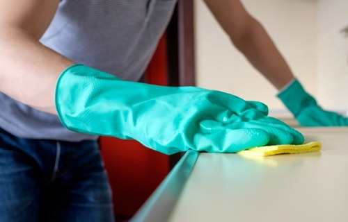 Cleaner checking the area for hazards and keeping the workspace secure